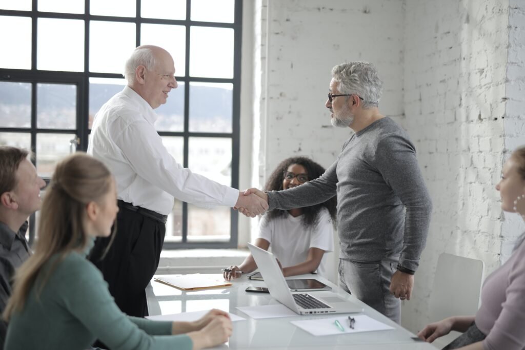 Property developers agreeing a London property management partnership